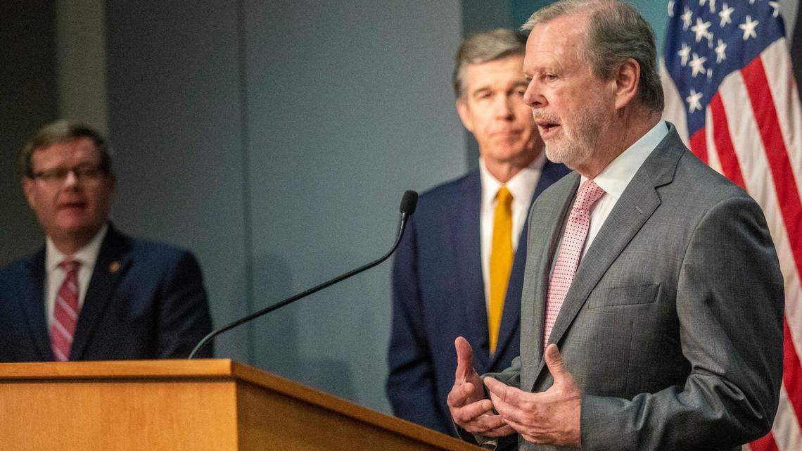 Senate leader Phil Berger speaks as House Speaker Tim Moore and Gov. Roy Cooper look on during a briefing on North Carolina’s coronavirus pandemic response Monday, May 4, 2020, at the NC Emergency Operations Center in Raleigh, N.C.