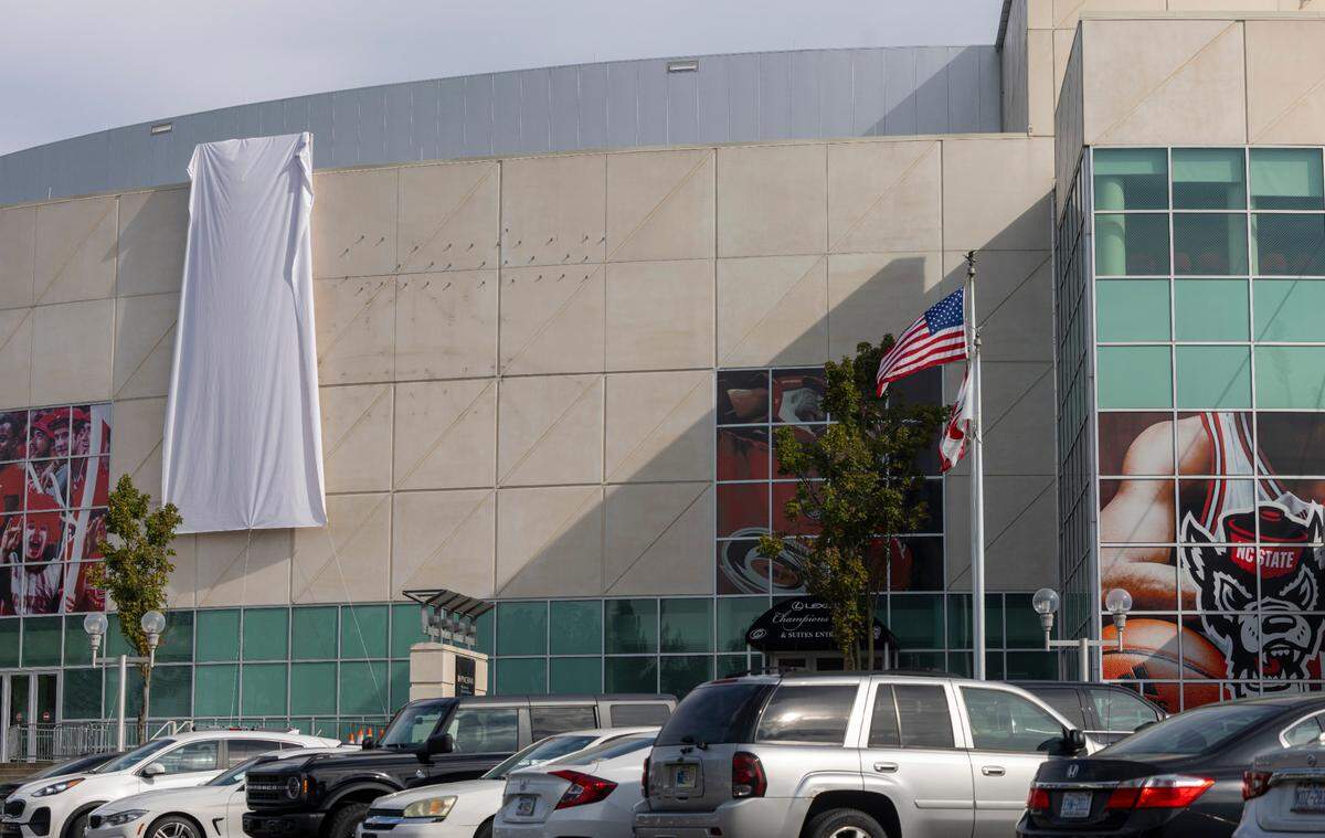 A new logo remains covered on the former PNC Arena on Thursday, September 12, 2024 in Raleigh, N.C. The Centennial Authority approved the new naming rights agreement between Lenovo and the Carolina Hurricanes to rename the team’s home arena “Lenovo Center”. The agreement will run for 10 years.