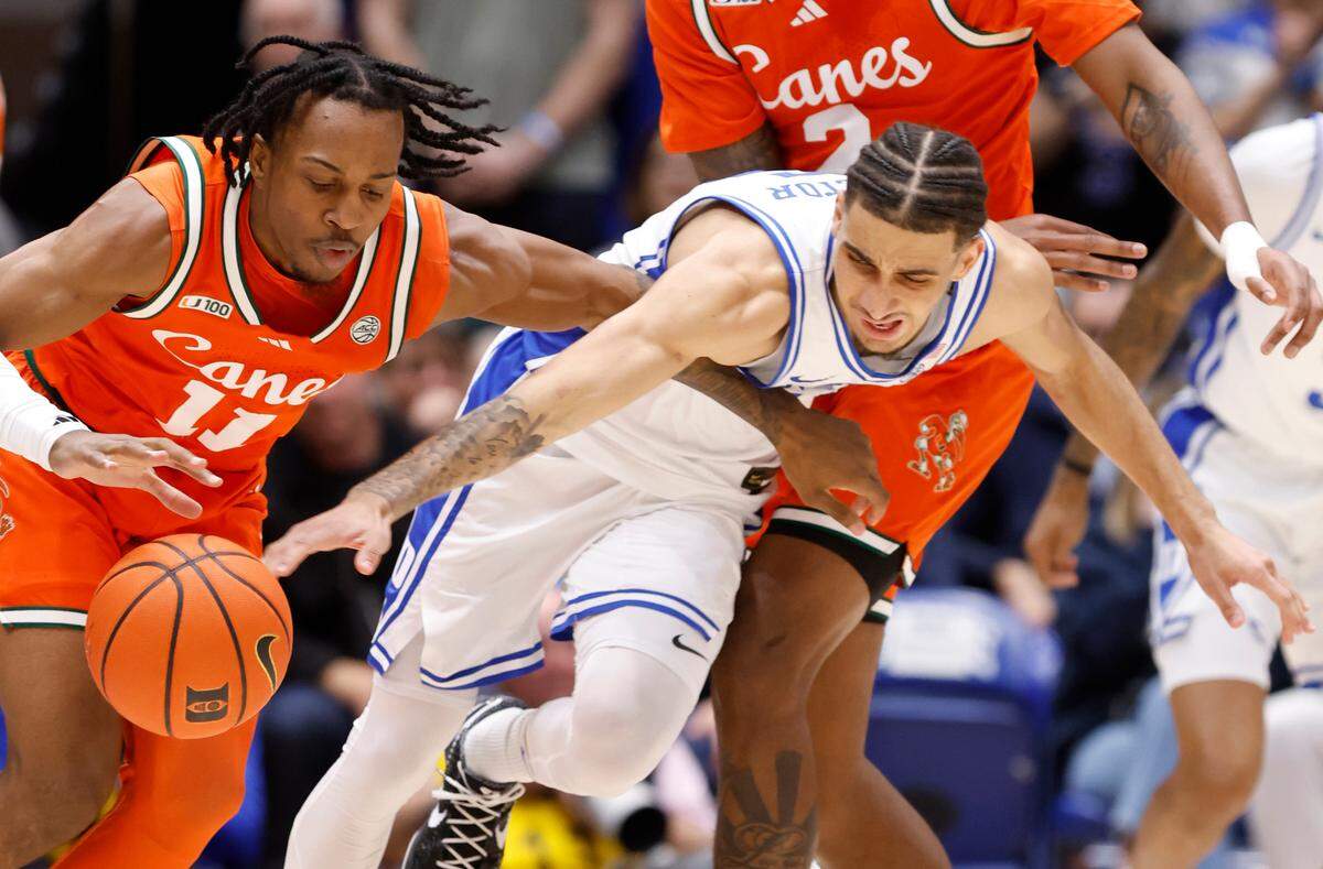Duke’s Tyrese Proctor (5) goes after the ball controlled by Miami’s A.J. Staton-McCray (11) during the first half of Duke’s game against Miami at Cameron Indoor Stadium in Durham, N.C., Tuesday, Jan. 14, 2025.