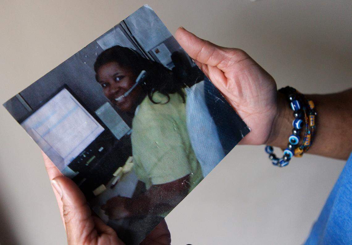 Tralene Williams, a state employee of 18 years, holds a photograph of herself taken in 2008 at her home in Knightdale, N.C. on Wednesday, Jan. 31, 2024. The decision by State Health Plan leaders to cut coverage of all obesity GLP-1 medications beginning April 1 will lead Williams to lose access to Wegovy.