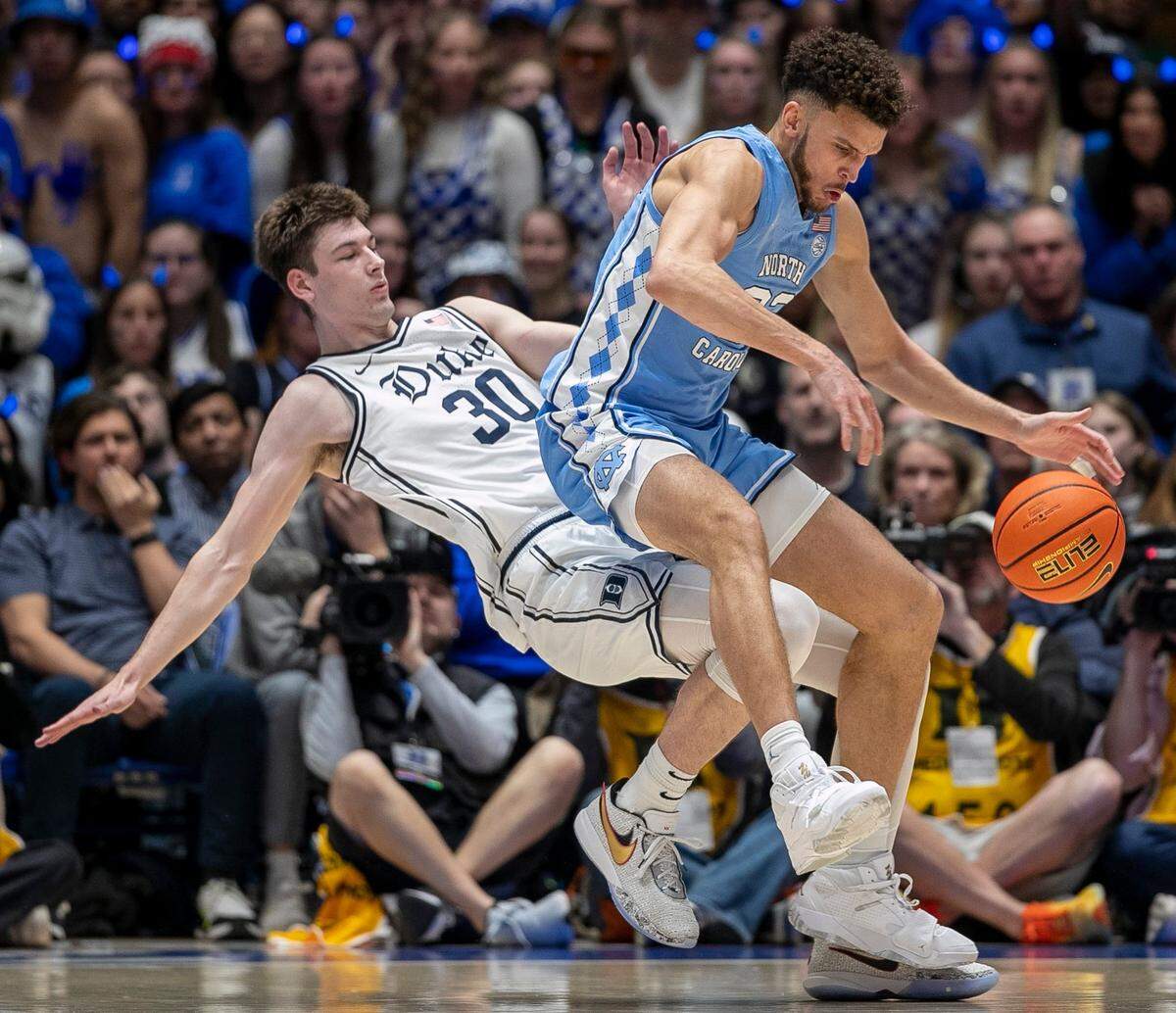 North Carolina’s Pete Nance (32) collides with Duke’s Kyle Filipowski (30) during the first half on Saturday, February 4, 2023 at Cameron Indoor Stadium in Durham, N.C