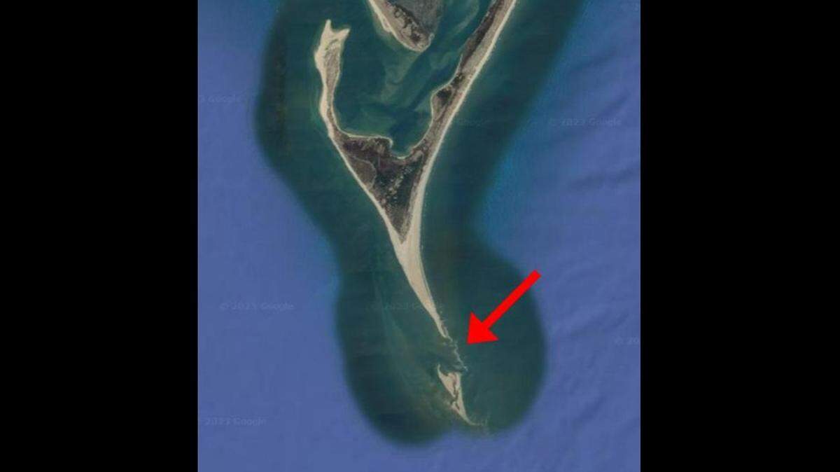 This satellite image of Cape Lookout shows a narrow bar of land is growing between a site known as The Point and Shark Island to the south.