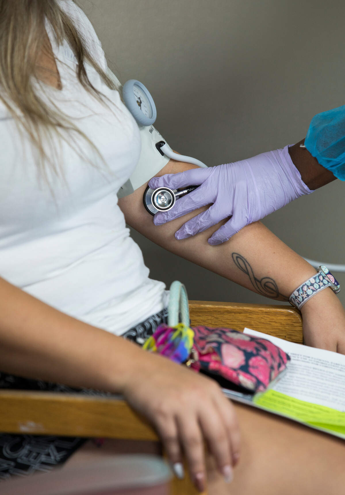 Emmily Mangum has her blood pressure taken by Talia Roofe after receiving monoclonal antibody treatment for COVID-19 at a clinic in the Johnston County Public Health Department parking lot in Smithfield, N.C. on Wednesday, Sept. 15, 2021.