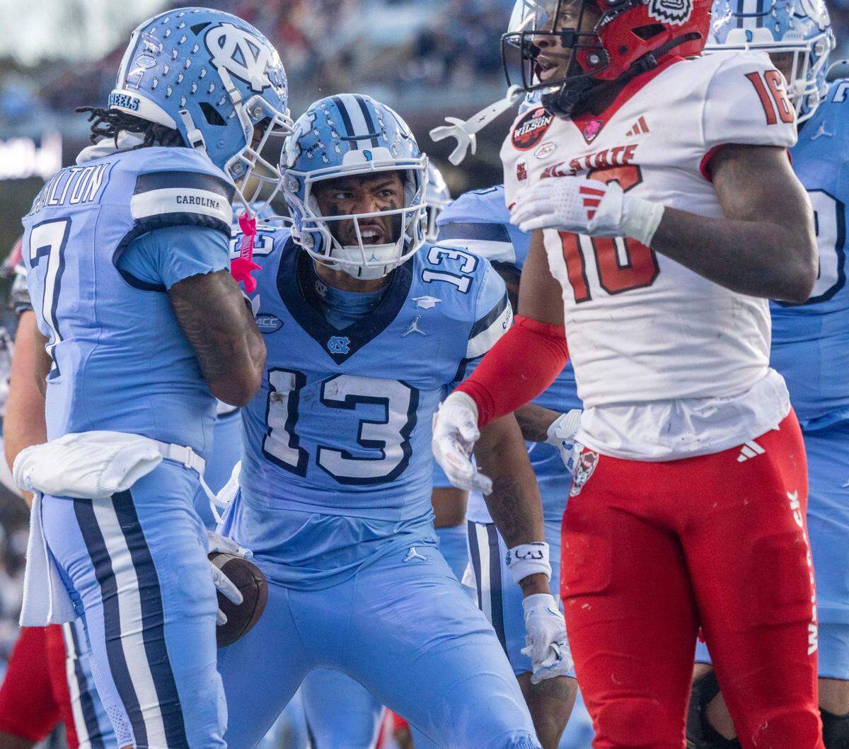 North Carolina receiver J.J. Jones (13) reacts after scorning a touchdown on a 17-yard pass from quarterback Jacolby Criswell in the second quarter on Saturday, November 30, 2024 at Kenan Stadium in Chapel Hill, N.C.