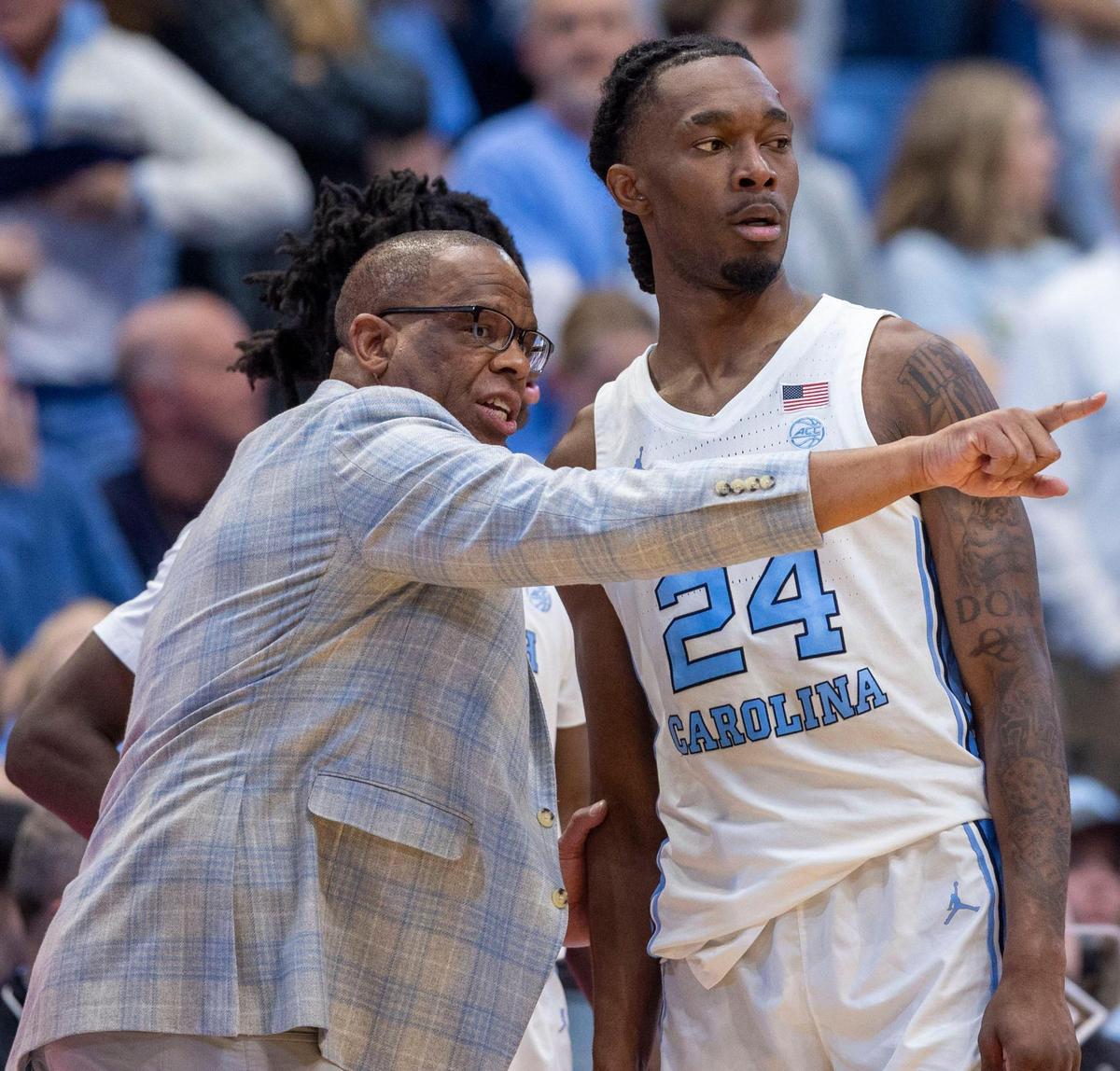 North Carolina coach Hubert Davis has a word with Jae’Lyn Withers (24) in the second half against Georgia Tech on Saturday, December 7, 2024 at the Smith Center in Chapel Hill, N.C.