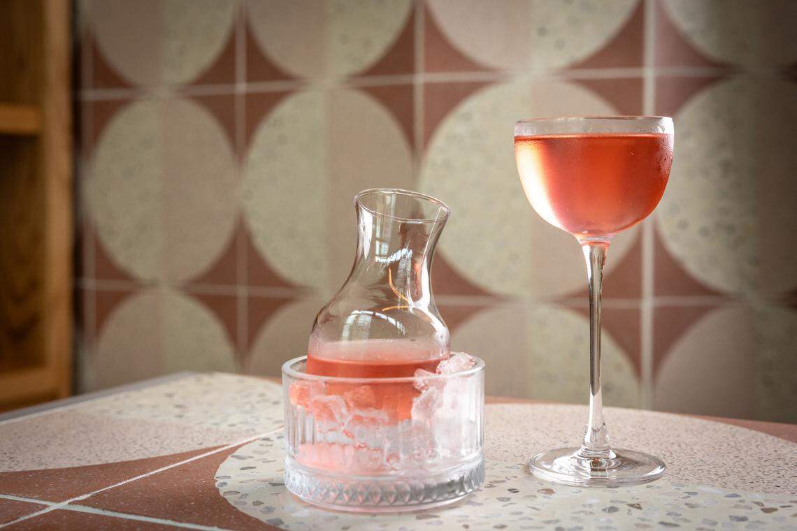 The Obsequy is a peach-colored martini on the opening menu of Boatman Spirits Co.