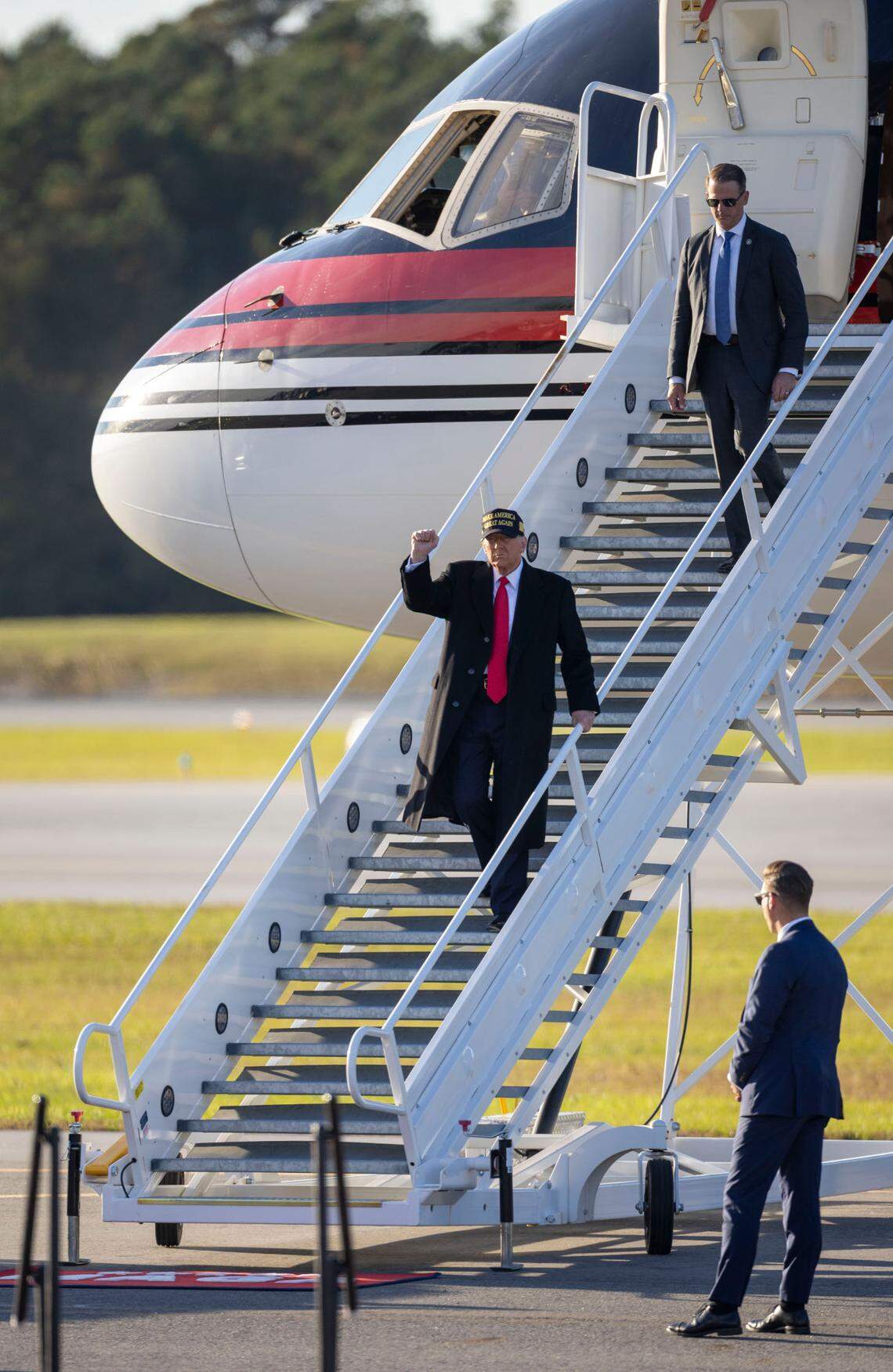 Republican presidential nominee, former President Donald Trump, arrives for a campaign rally on Sunday, November 3, 2024 at the Kinston Regional Jetport in Kinston, N.C.