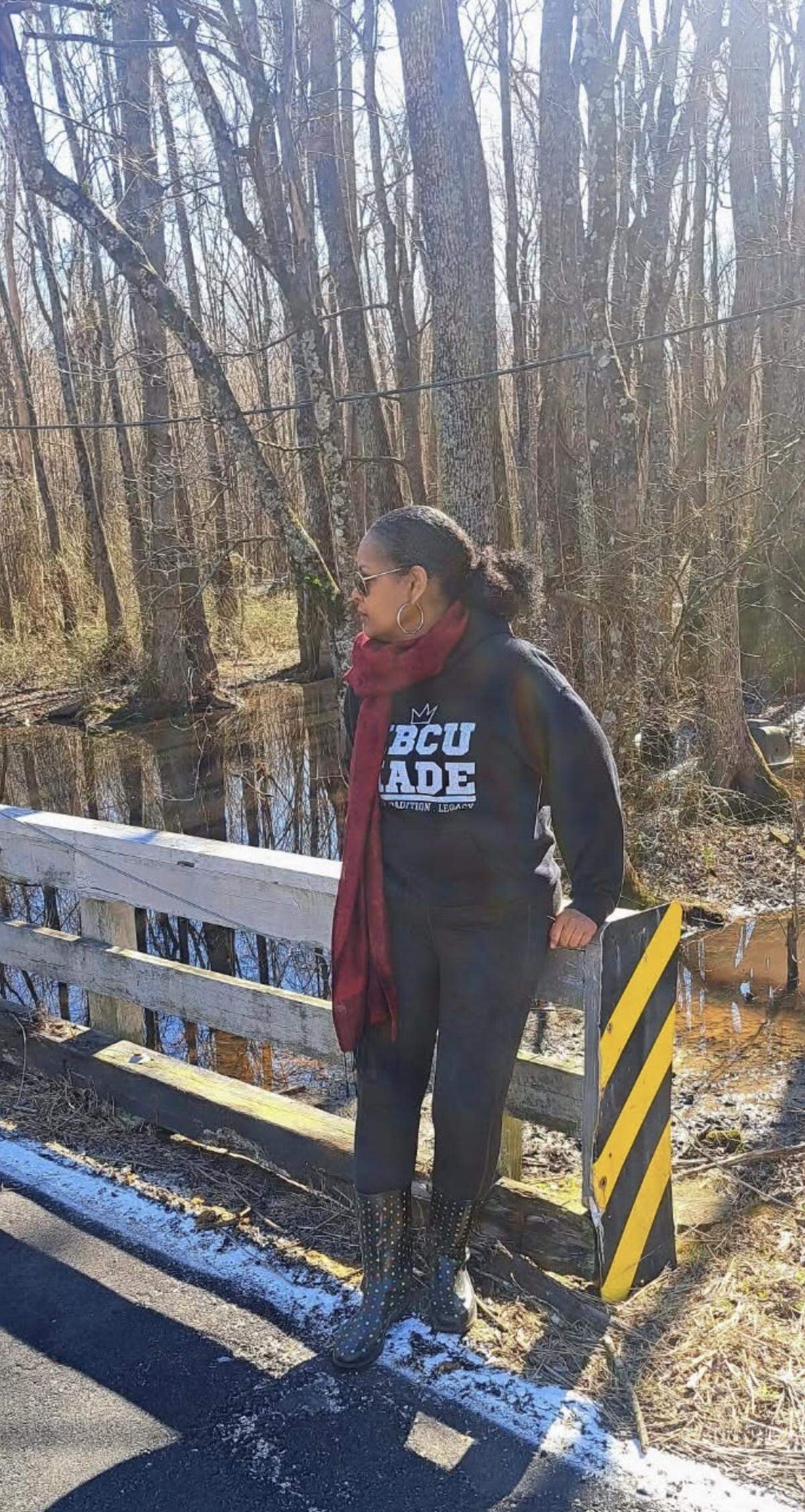 Shelia Moses stands on the bridge where she believes her brother Daniel was killed in 2011. This year marks the 15th year of his disappearance with no arrests or answers.
