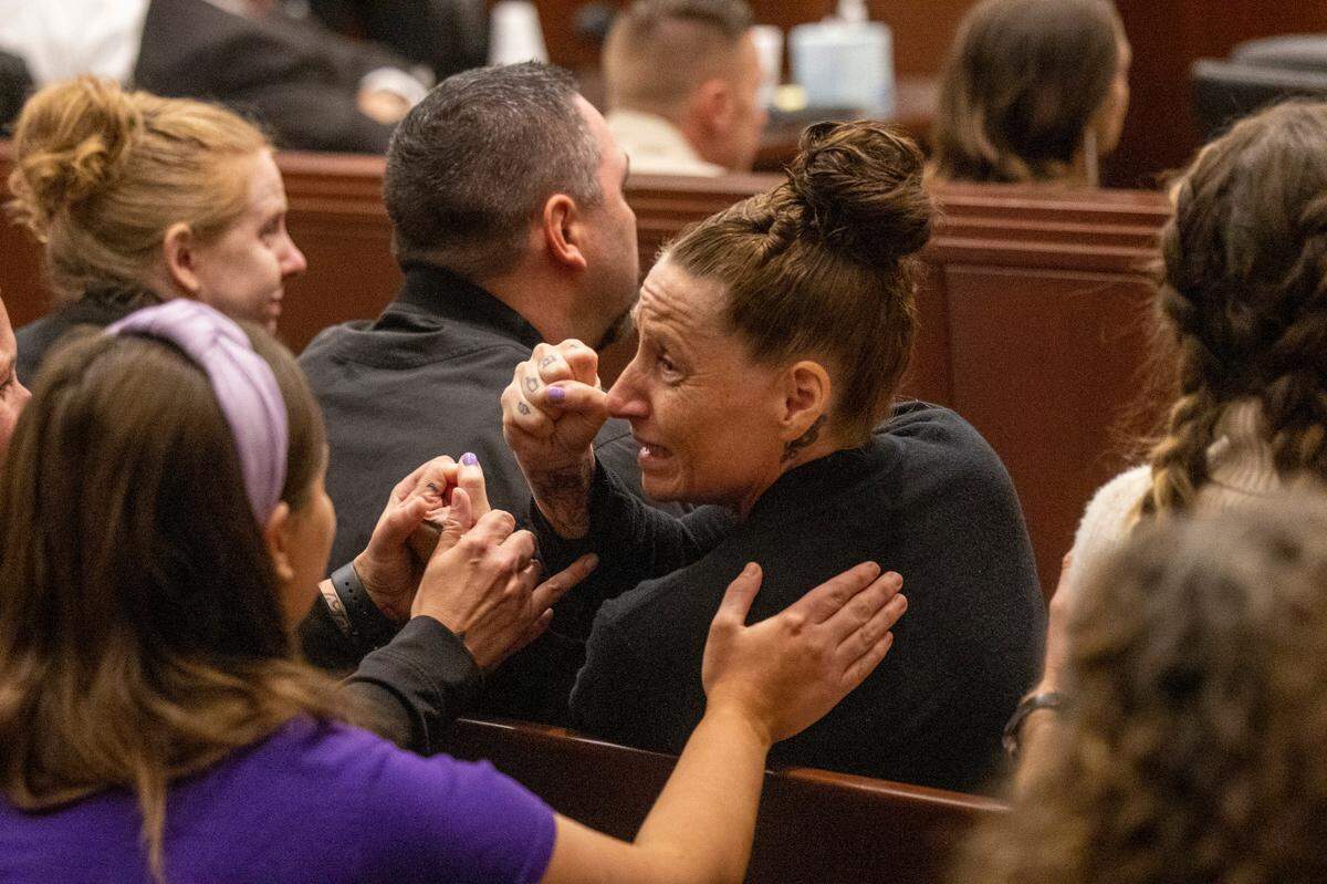 Melanie Tucker, the mother of Monica Moynan, center, reacts after Brian Sluss was found guilty in the 2019 murder of his Moynan in Wake County District Court Thursday, April 28, 2022. Moynan, who shared two children with Sluss, was reported missing in mid-July of 2019, and her body has never been found.
