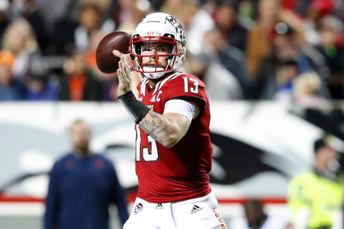 N.C. State quarterback Devin Leary (13) prepares to pass during the second half of N.C. State’s 41-17 victory over Syracuse at Carter-Finley Stadium in Raleigh, N.C., Saturday, Nov. 20, 2021.