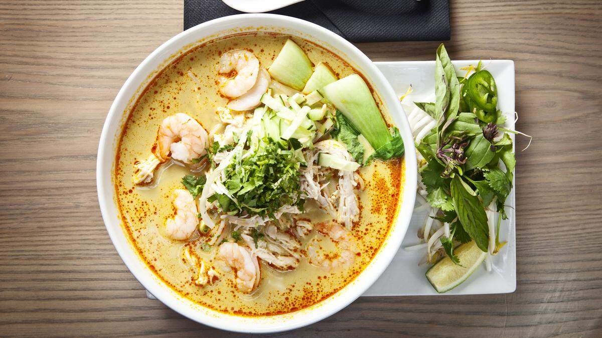 Asian fusion restaurant CO opens March 17, 2018 for dinner in North Hills. This is CO's curry laksa, a bowl of rice noodles and shredded chicken in a spicy coconut broth.