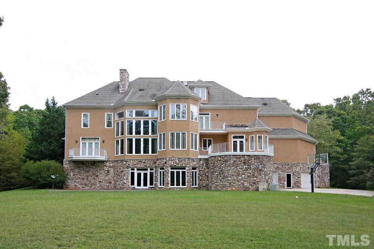This home in Wake Forest is selling for $2.1 million is located at 2115 Rolling Rock Road is a naturally private residence, sitting on a 405,279 square-foot lot surrounded by forest and only a few hundred feet away from Falls Lake.
