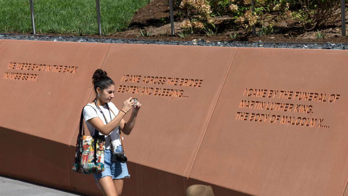 A person walks through North Carolina Freedom Park following a ceremony to mark its opening on Wednesday, Aug. 23, 2023, in Raleigh, N.C. The park honors the African American struggle for freedom.