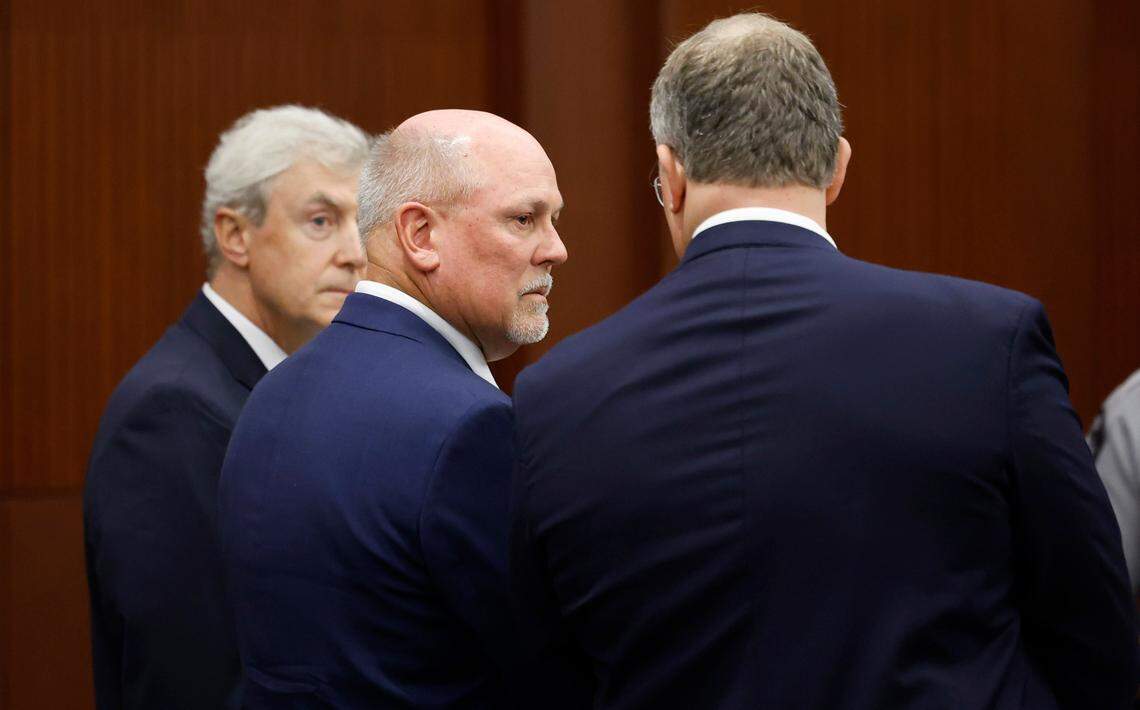 Alan Thompson confers with his attorneys Roger Smith, left, and Russell Babb while appearing in court in Raleigh, N.C., Wednesday, Sept. 25, 2024. Thompson, the father of the accused Hedingham mass shooter, pleaded guilty to a misdemeanor charge of storing a firearm with a minor’s unsafe access. Thompson lost his son James in the Oct. 13, 2022 shooting spree in which his younger son Austin, then 15, is charged with killing five people and injuring two others.