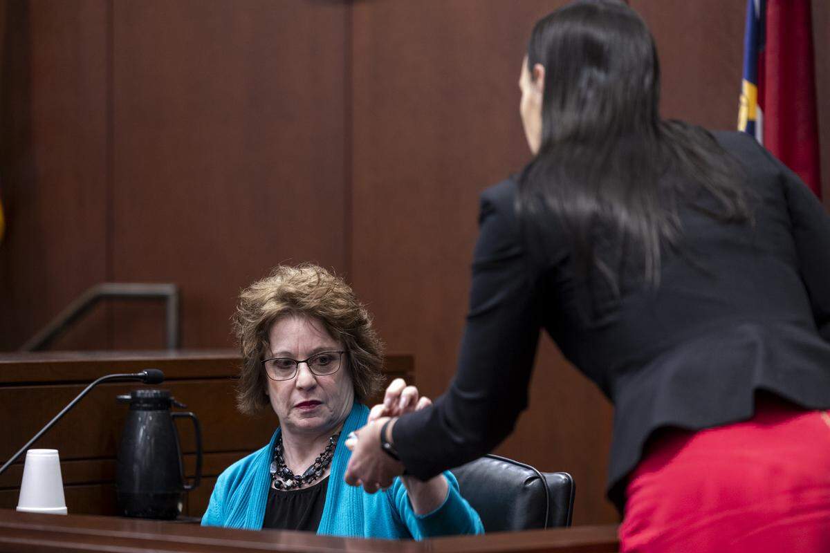 Defense attorney Kellie Mannette, right, questions Elise Thompson, the mother of Austin Thompson, during a sentencing hearing in Wake County Superior Court in Raleigh on Tuesday, Feb. 10, 2026. Thompson, now 18, pleaded guilty to the 2022 Hedingham neighborhood mass shooting that killed five people. He was 15 at the time of the killings.