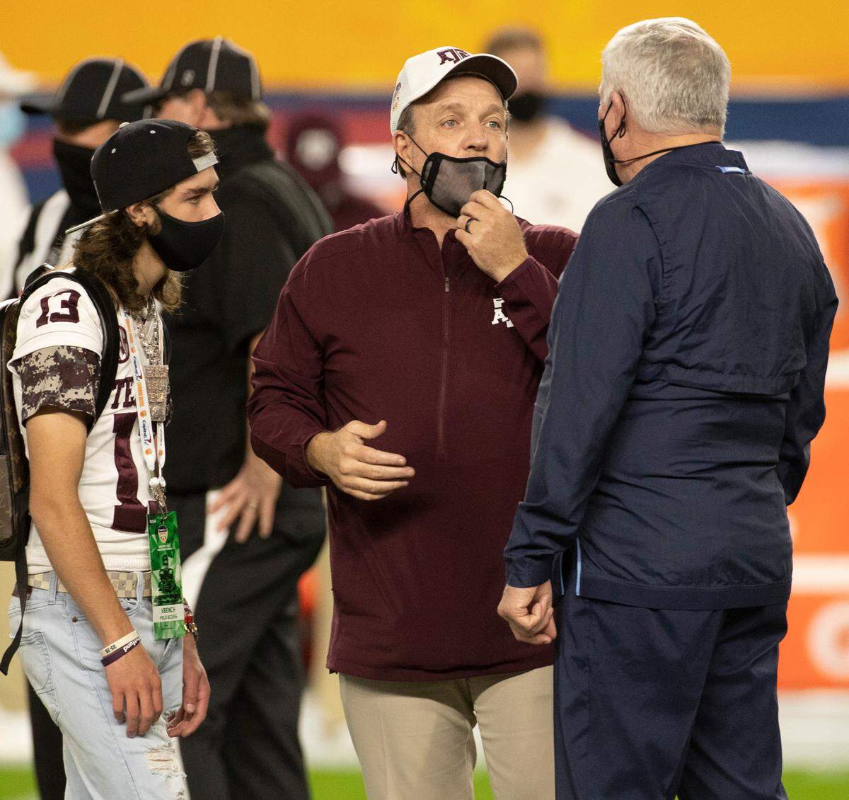 North Carolina coach Mack Brown talks with Texas A&M head coach Jimbo Fisher prior to their game in the Capital One Orange Bowl on Saturday, January 2, 2021in Miami Gardens, Florida.