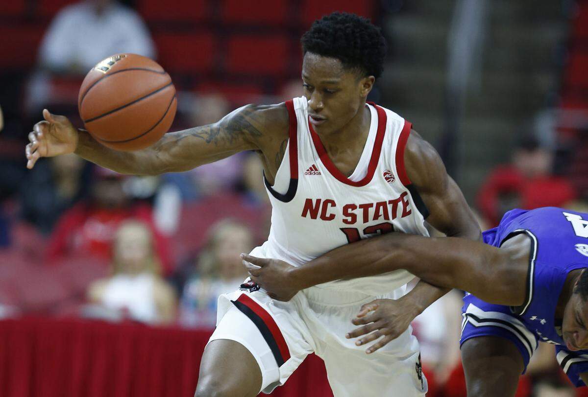 N.C. State’s C.J. Bryce (13) steals the ball from Chowan’s Keon Claiborne during the first half of N.C. State’s exhibition game against Chowan at PNC Arena in Raleigh, N.C., Monday, Oct. 29, 2018.