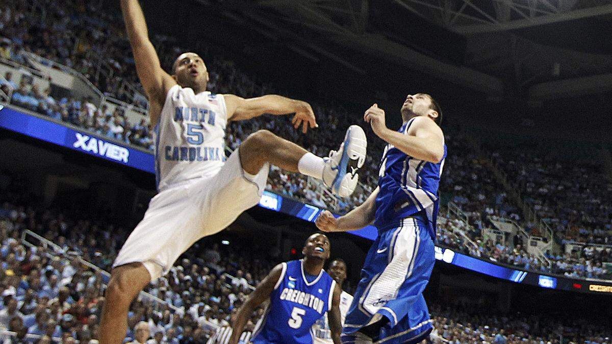 UNC guard Kendall Marshall (5) is fouled by Creighton forward Ethan Wragge (34) at the 10:57 mark of the second half. Marshall landed hard out of bounds and suffered a fractured scaphoid bone in his right wrist.