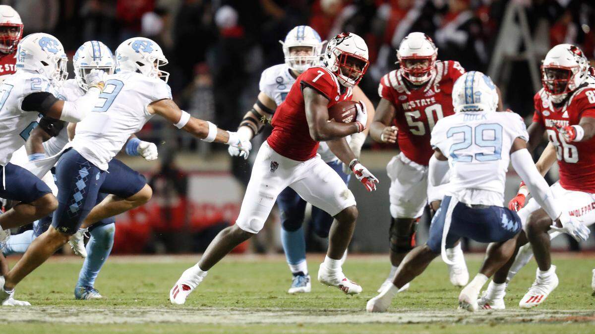 N.C. State running back Zonovan ‘Bam’ Knight (7) breaks free for a long run after a pass reception during the first half of N.C. State’s game against UNC at Carter-Finley Stadium in Raleigh, N.C., Friday, November 26, 2021.