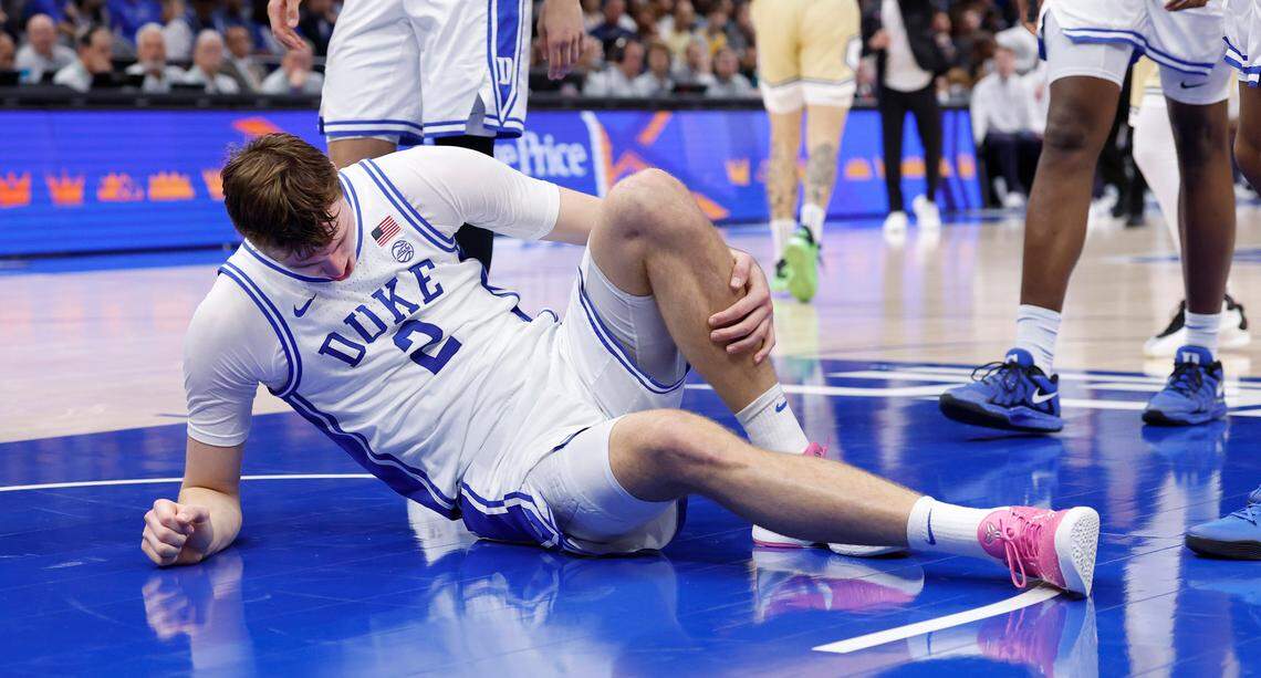 Duke’s Cooper Flagg (2) holds his left leg after being injured during the first half of Duke’s game against Georgia Tech in the quarterfinals of the 2025 ACC Men’s Basketball Tournament at the Spectrum Center in Charlotte, N.C., Thursday, March 13, 2025.