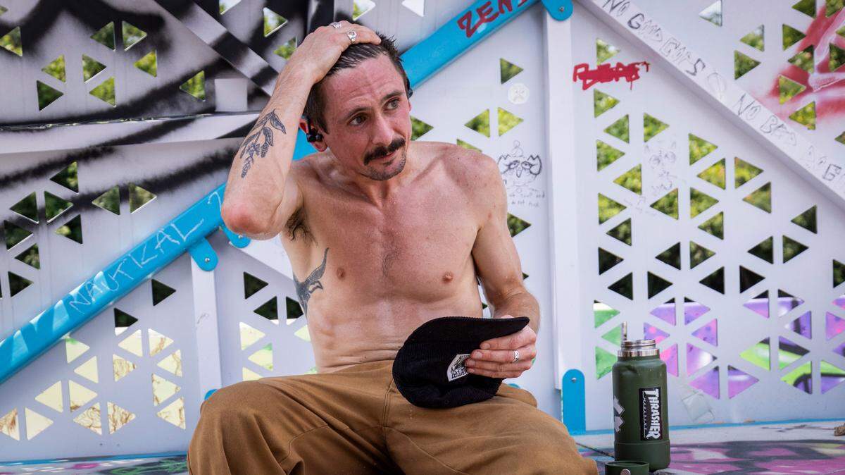 Matt Brokaw, 35, of Raleigh takes a break under a shelter while trying to perfect a skateboard trick at Conlon Family Skatepark near downtown Raleigh as temperatures climbed into the mid-90s on Thursday afternoon, June 26, 2025. “I can only skate a couple minutes and then I gotta stop. I get about five tries and then I about keel over,” Brokaw said between gulps of water. “Makes you want to go home and get an icy pop.”