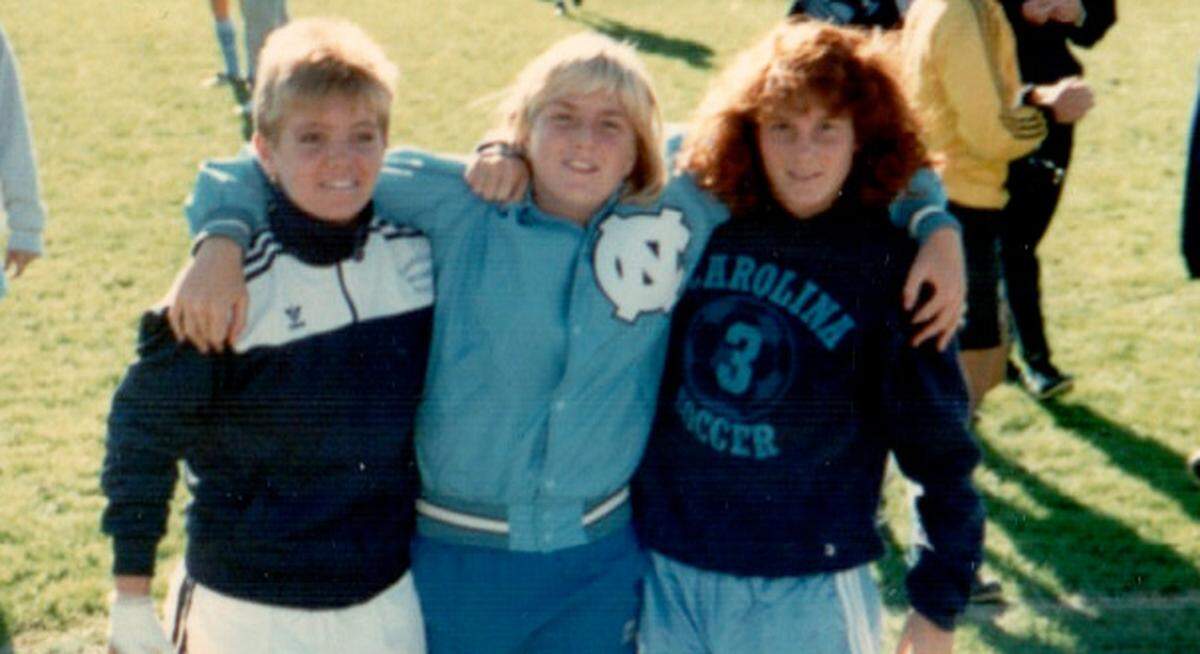 Courtney Lehmann, left, with teammates Julie Carter, center, and Kristin Acquavella, right.