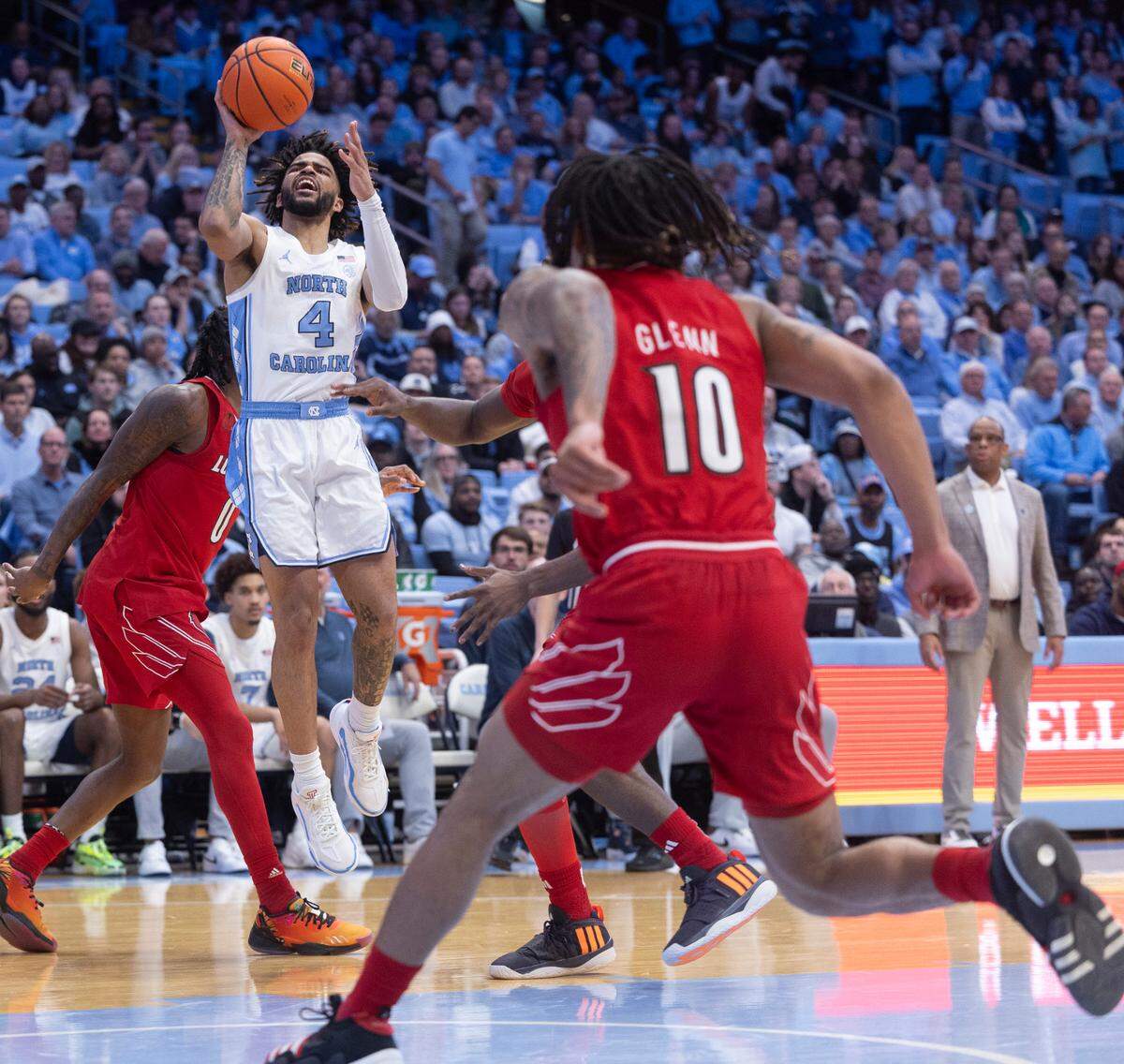North Carolina’s R.J. Davis (4) breaks to the basket through the Louisville defense in the second half on Wednesday, January 17, 2024 at the Smith Center in. Chapel Hill, N.C.