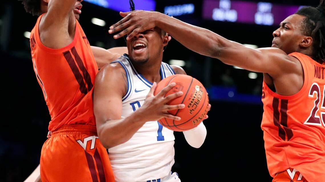 Duke’s Trevor Keels (1) is fouled as he heads to the basket as Virginia Tech’s David N’Guessan (1) and Justyn Mutts (25) defend during the second half of Virginia Tech’s 82-67 victory over Duke in the finals of the ACC men’s basketball tournament at the Barclays Center in Brooklyn, N.Y., Saturday, March 12, 2022.