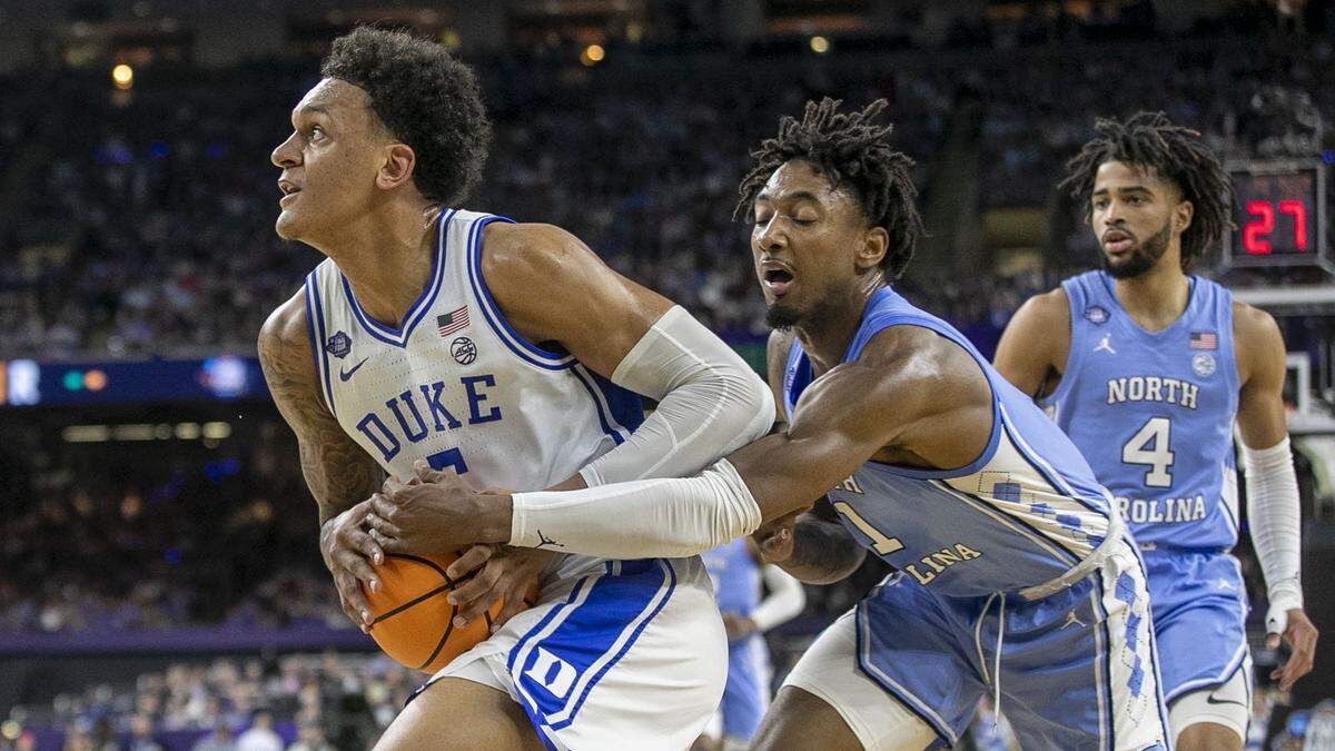North Carolinaís Leaky Black (1) tries for a steal from Dukeís Paolo Banchero (5) in the first half during the NCAA Final Four semi-final on Saturday, April 2, 2022 at Caesars Superdome in New Orleans, La.