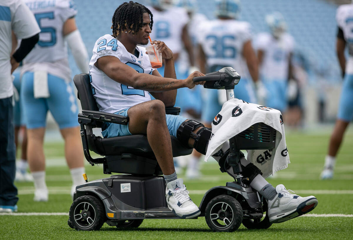 North Carolina’s Malaki Hamrick (24), out with an injury, watches the defensive unit warm up the Tar Heels’ spring football game on Saturday, April 15, 2023 at Kenan Stadium in Chapel Hill, N.C.
