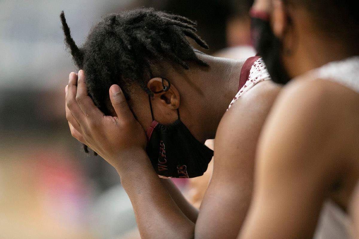 Warren County’s Jah’Quell Hendrick (11) hangs his head after coming out of the game with a large deficit against Webb on Friday, January 29, 2021 in Warrenton, N.C. 
