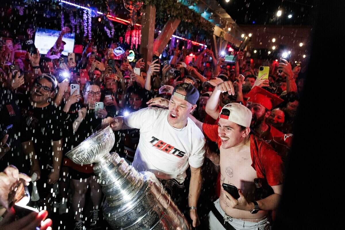 The Stanley Cup makes an appearance at Teets bar in Raleigh's Glenwood South district on Monday, June 15, 2026, as Carolina Hurricanes fans celebrated with the team’s players and staff following the Hurricanes’ Stanley Cup final 4-2 victory over the Vegas Golden Knights the evening prior.