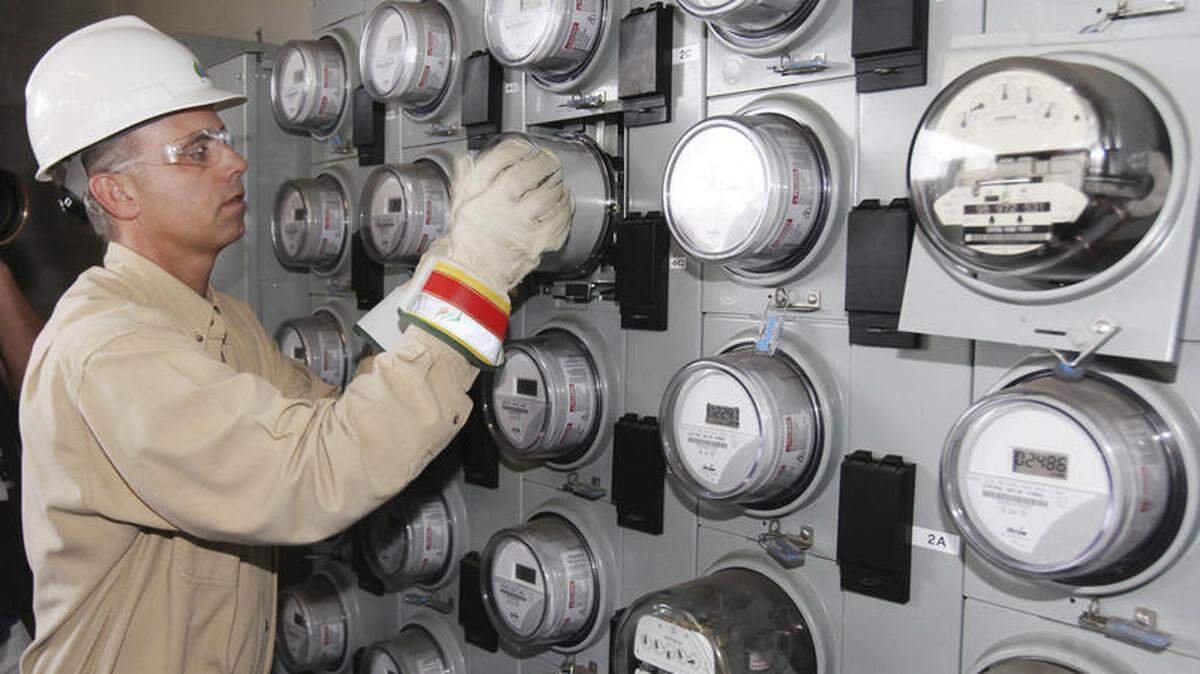 In this Sept. 28, 2010, file photo, Central Maine Power technician Gary Sturgis installs one of the company’s first “smart meters” at an apartment building in Portland, Maine. Maine’s Supreme Court ruled on, Jan. 26, 2016, affirmed a decision by the Maine Public Utilities Commission that Central Maine Power’s “smart meter” system poses no credible threat to the health and safety of customers. (AP Photo/Joel Page, File)