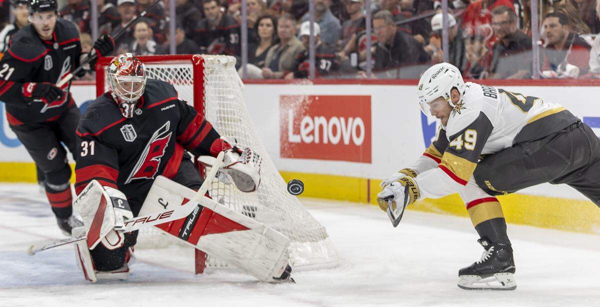 Vegas left wing Ivan Barbashev (49) tries to get his stick on the puck in front of  Carolina Hurricanes goalie Frederik Andersen (31) in the second period in Game 2 of the Stanley Cup Final, on Thursday, June 4, 2026 at Lenovo Center in Raleigh, N.C. 