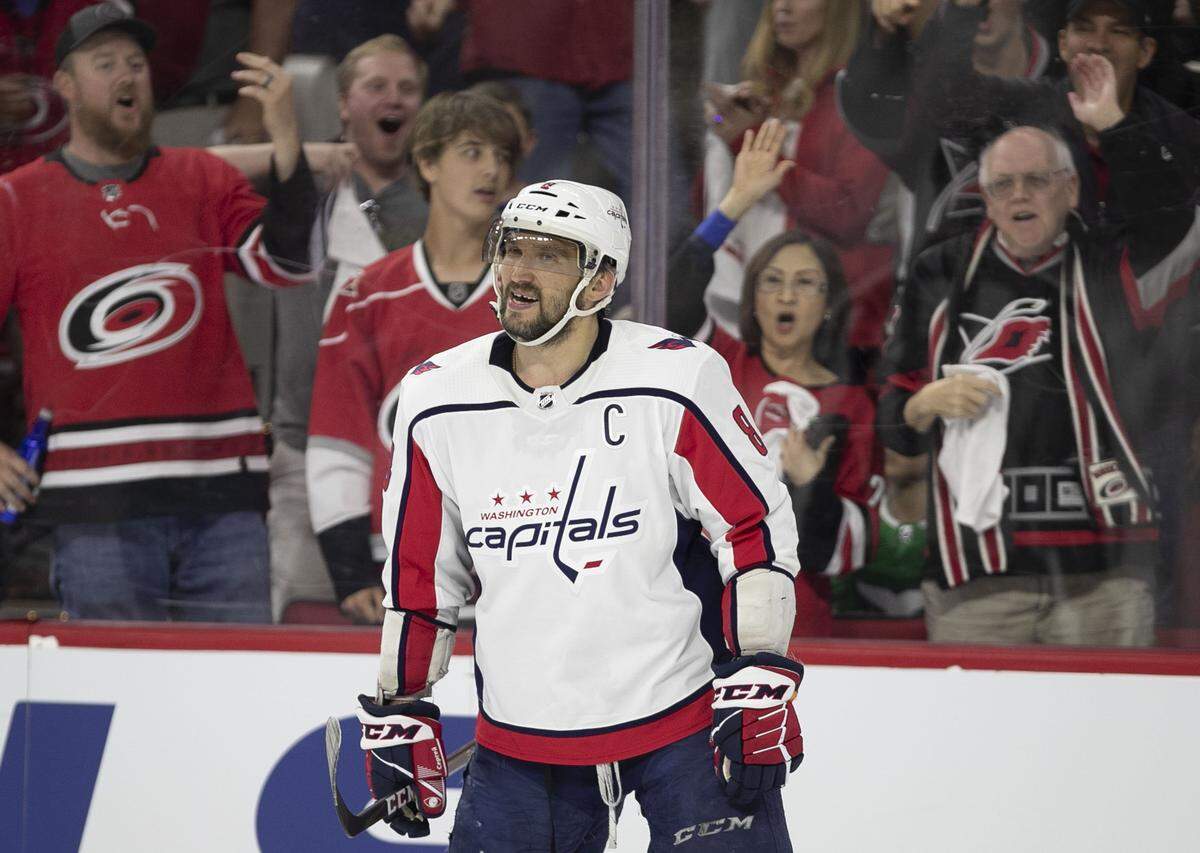 Carolina Hurricanes’ fans react after Washington Capitals’ Alex Ovechkin (8) was called for a misconduct penalty in the third period during Game 6 of their first round Stanley Cup series game on Monday, April 22, 2019 at PNC Arena in Raleigh, N.C.
