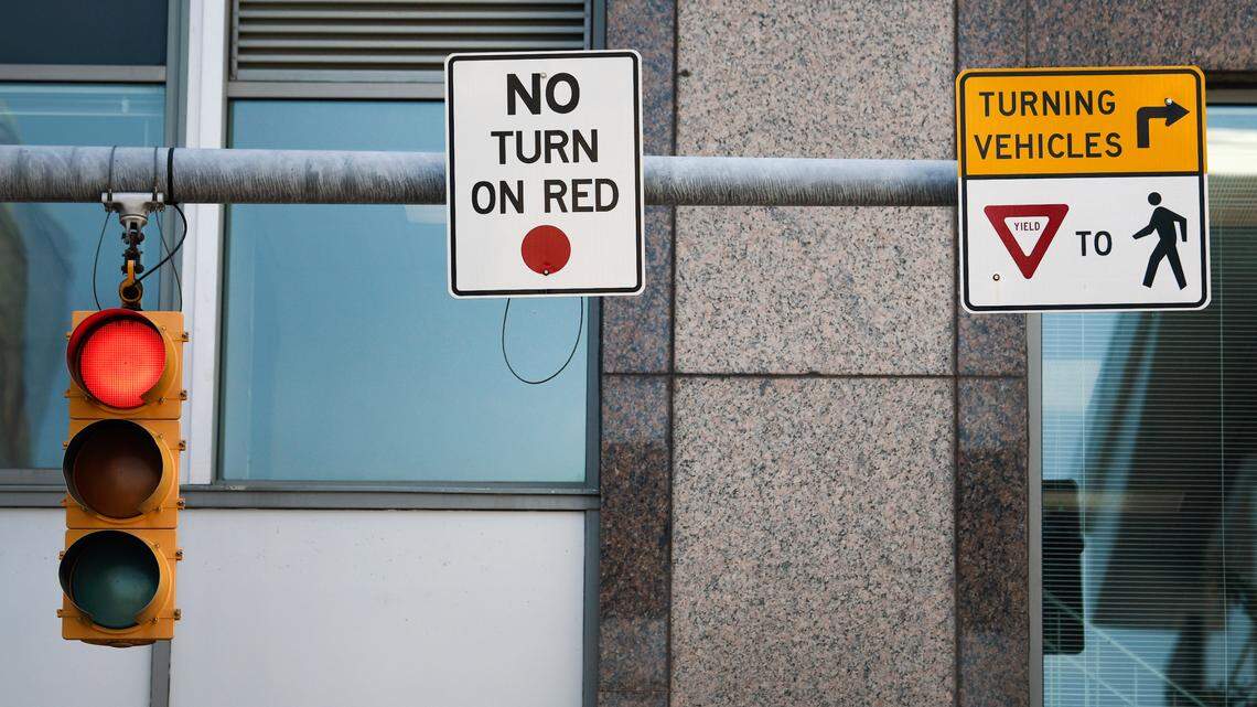 Signs advising drivers that there is no right turn on a red light have appeared in increasing numbers in downtown Raleigh.