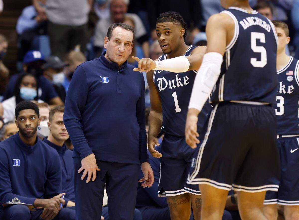 Duke head coach Mike Krzyzewski talks with Trevor Keels (1) during the first half of UNC’s game against Duke at the Smith Center in Chapel Hill, N.C., Saturday, Feb. 5, 2022.