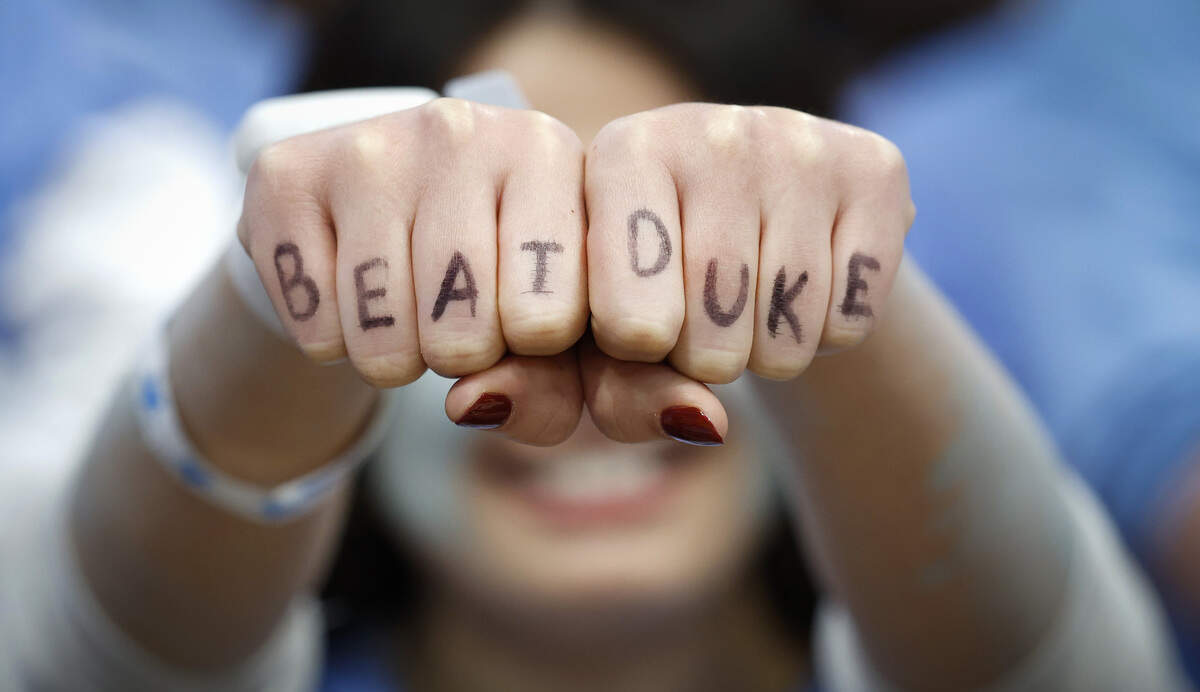 North Carolina senior Katherine Sullivan used her fingers to cheer on the Tar Heels before Duke’s game against UNC at the Dean E. Smith Center in Chapel Hill, N.C., Saturday, Feb. 7, 2026.
