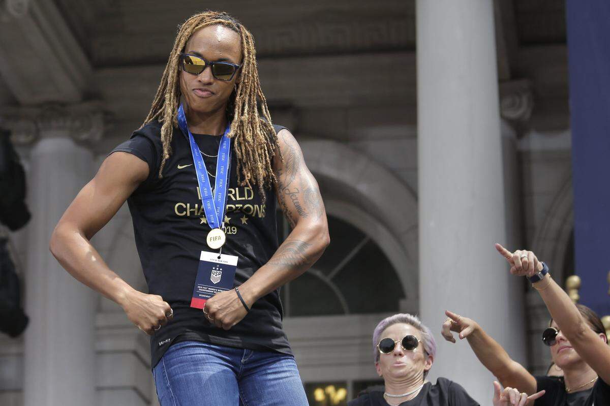 The U.S. women’s soccer team member Jessica McDonald flexes during a celebration at City Hall after a ticker tape parade, Wednesday, July 10, 2019, in New York. The U.S. national team beat the Netherlands 2-0 to capture a record fourth Women’s World Cup title. (AP Photo/Seth Wenig)
