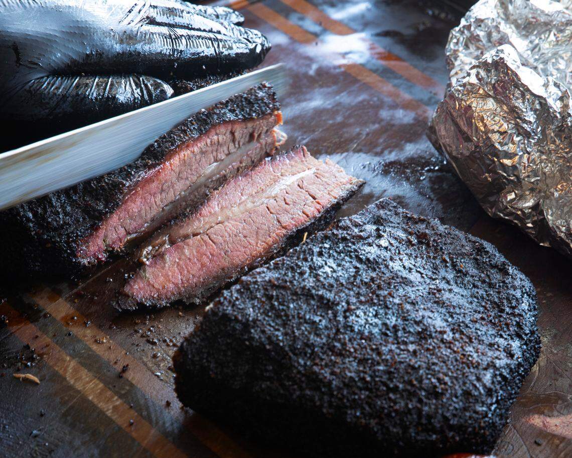 A luscious beef brisket is sliced to order at Dampf Good Barbecue in Morrisivlle.