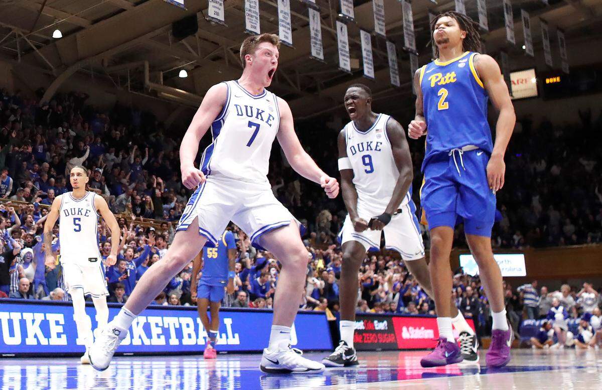 Duke’s Kon Knueppel (7) and Khaman Maluach (9) celebrate a slam by Cooper Flagg during Duke’s 76-47 victory over Pitt at Cameron Indoor Stadium in Durham, N.C., Tuesday, Jan. 7, 2025.