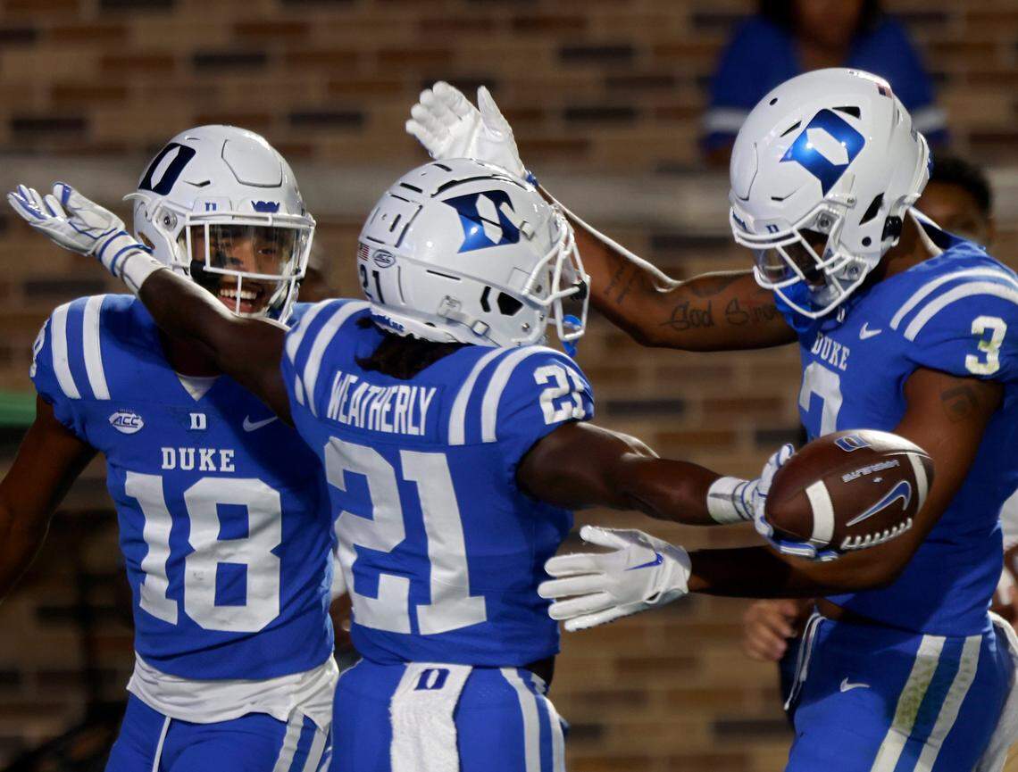 Duke Blue Devils wide receivers Malik Bowen-Sims and Darrell Harding Jr. congratulate running back Eric Weatherly after he scored a touchdown during the second half of Dukes game against North Carolina A&T at Wallace Wade Stadium in Durham, N.C. on Saturday, Sept. 17, 2022.