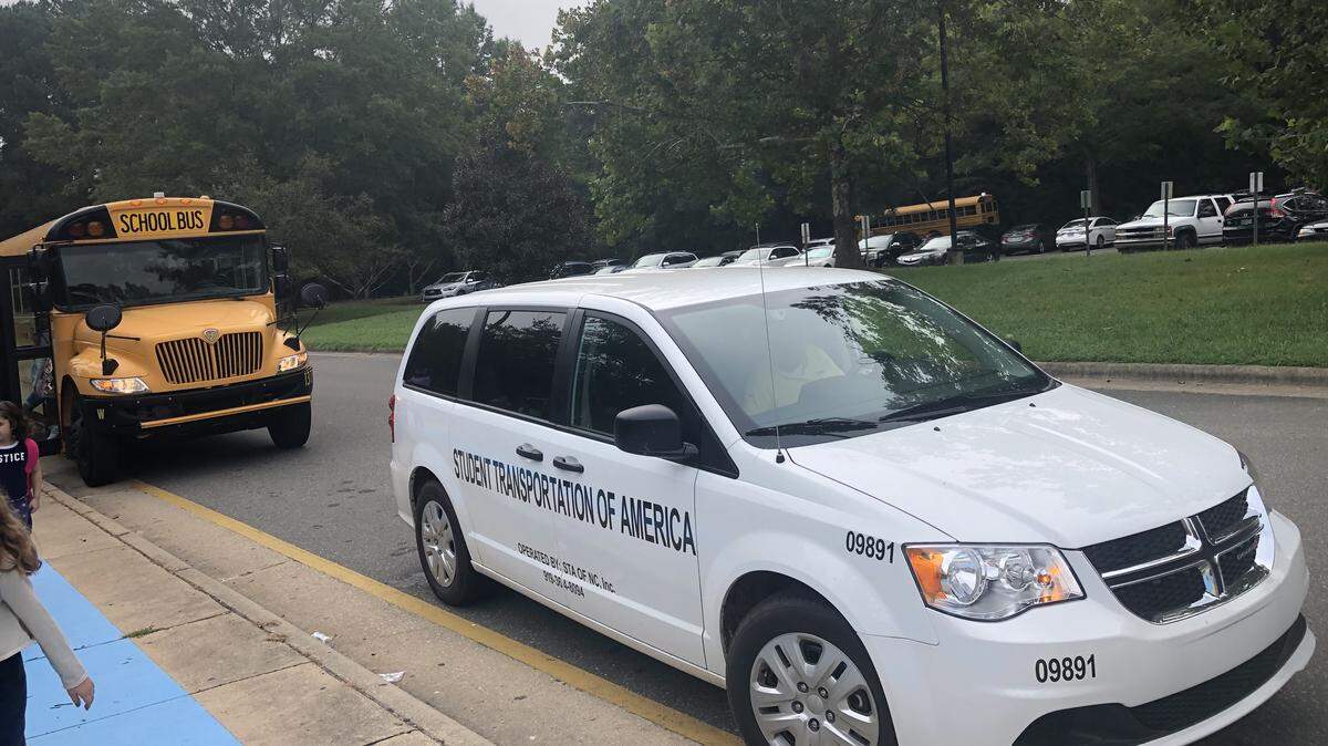 A vehicle from Student Transportation of America sits outside Fox Road Elementary School in Raleigh, NC, on Sept. 11, 2019 after dropping off a student at school.