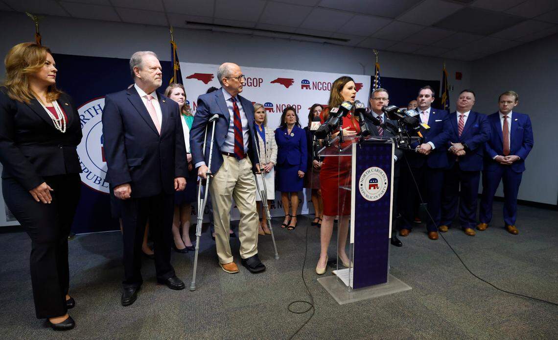 Flanked by N.C. Republican House and Senate leaders, N.C. State Rep. Tricia Cotham speaks during a press conference at the N.C. GOP headquarters in Raleigh, N.C. Wednesday, April 5, 2023. The press conference was to announce Rep. Cotham is switching parties to become a member of the House Republican caucus.