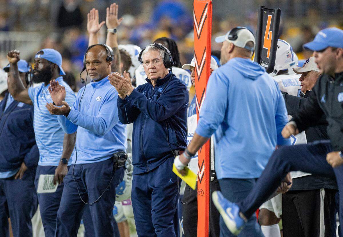 North Carolina coach Mack Brown and his assistants react after a field goal by Noah Burnett to take a 38-17 lead against Pitt in the third quarter on Saturday, September 23, 2023 at Acrisure Stadium in Pittsburgh, Pa.