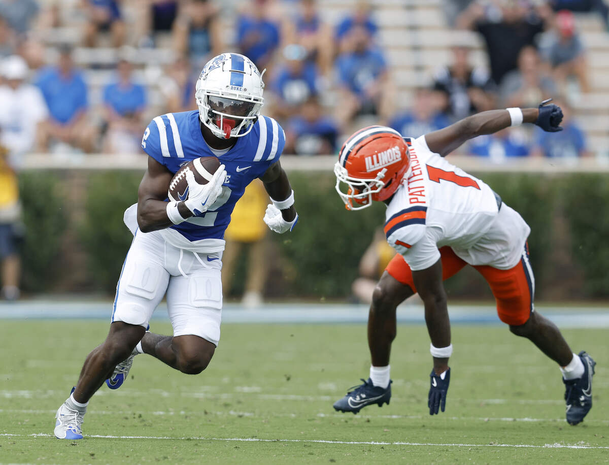 Duke’s Jaiden Francois runs the ball past Illinois’ Kaleb Patterson during the second half of the Blue Devils’ 45-19 loss on Saturday, Sept. 6, 2025, at Wallace Wade Stadium in Durham, N.C.