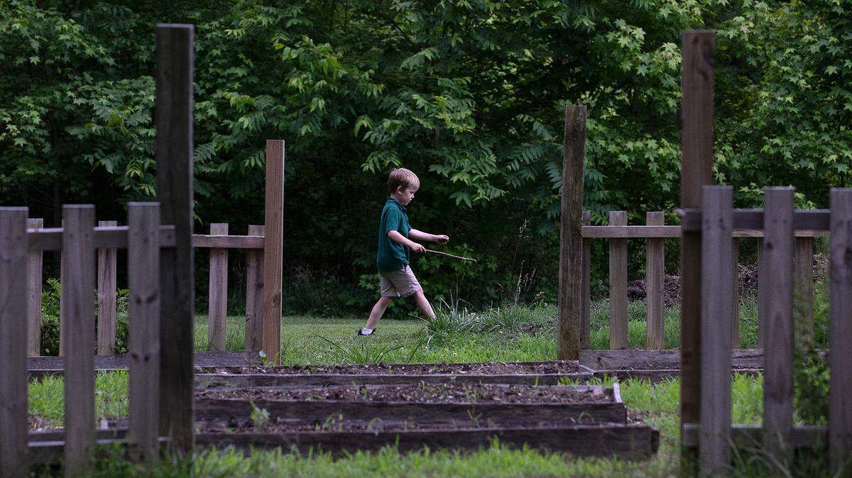 Lars Walter, 6, walks through the Duke Homestead State Historic Site on Wednesday, May 29, 2024, in Durham, N.C.