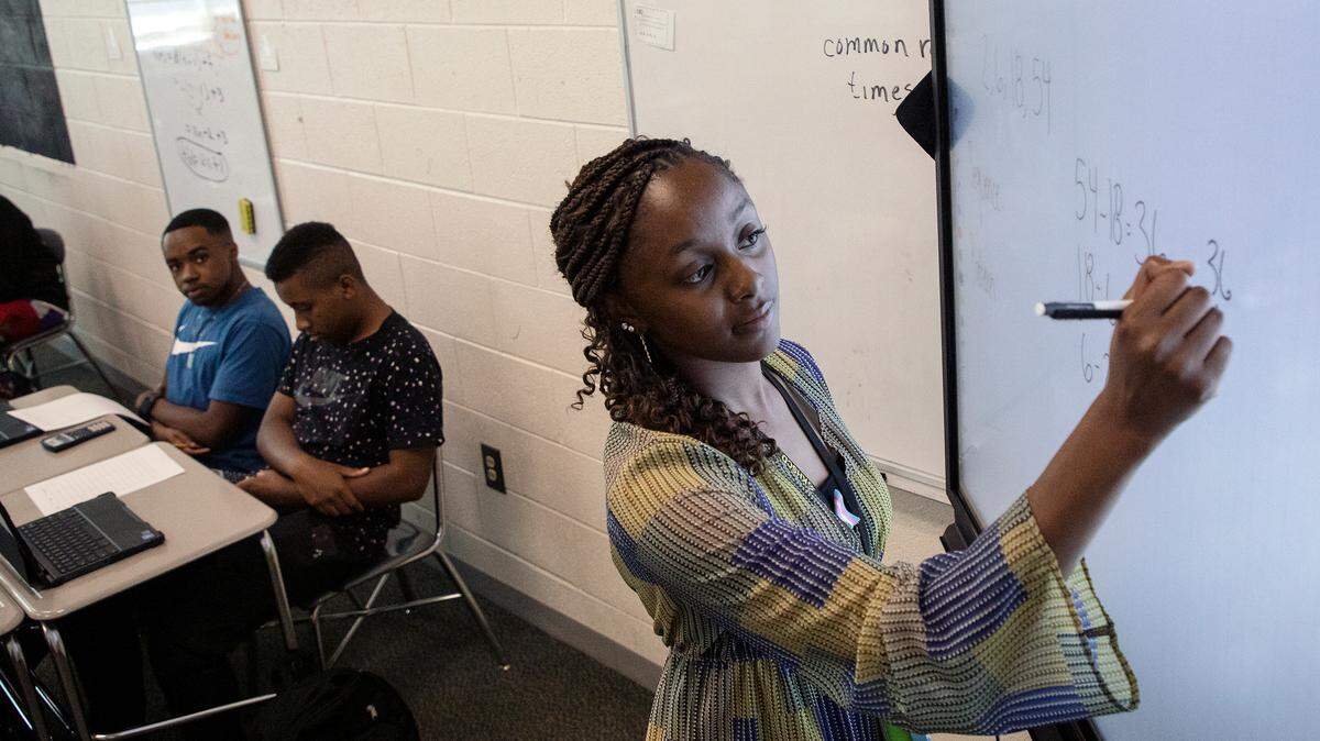 Students listen as Knightdale High School teacher Alex Johnson reviews examples of sequences during a math class on Tuesday, Sept. 5, 2023, in Knightdale, N.C.