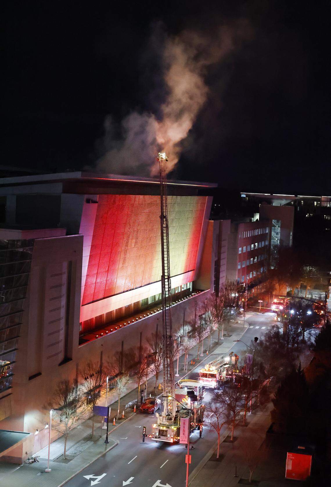 Firefighters battle a blaze at the Raleigh Convention Center in downtown Raleigh, N.C., Monday evening, Dec. 1, 2025.