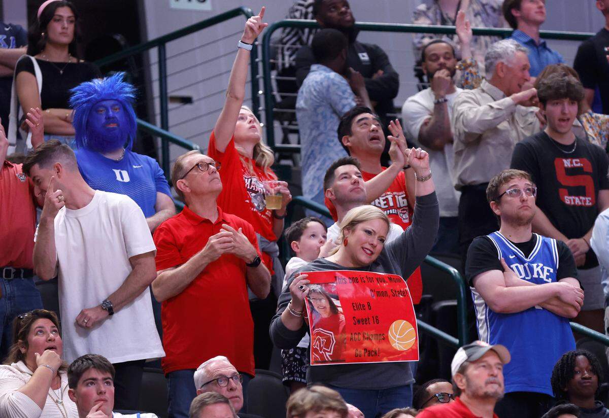 Wolfpack fans cheer on the team during the second half of N.C. State’s 76-64 victory over Duke in their NCAA Tournament Elite Eight matchup at the American Airlines Center in Dallas, Texas, Sunday, March 31, 2024.